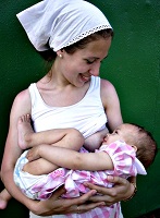 Woman breastfeeding an infant-sm